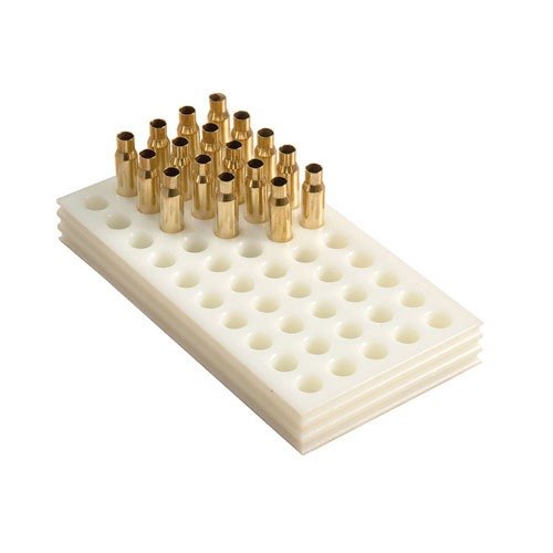 I blocchi di carico in polietilene bianco sono resistenti, facili da pulire e progettati per una presa sicura, ideali per cartucce di medie e lunghe dimensioni.